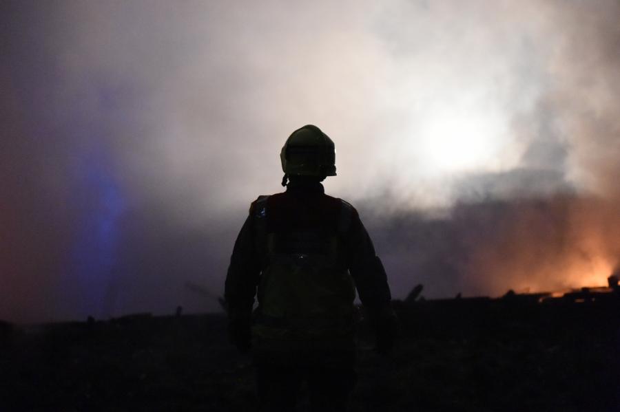 silhouette firefighter smoke night