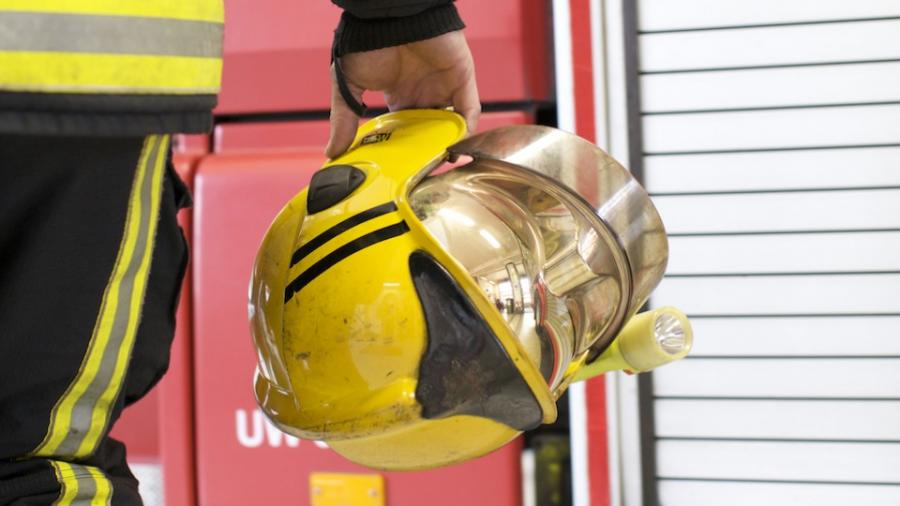 holding-fire-helmet
