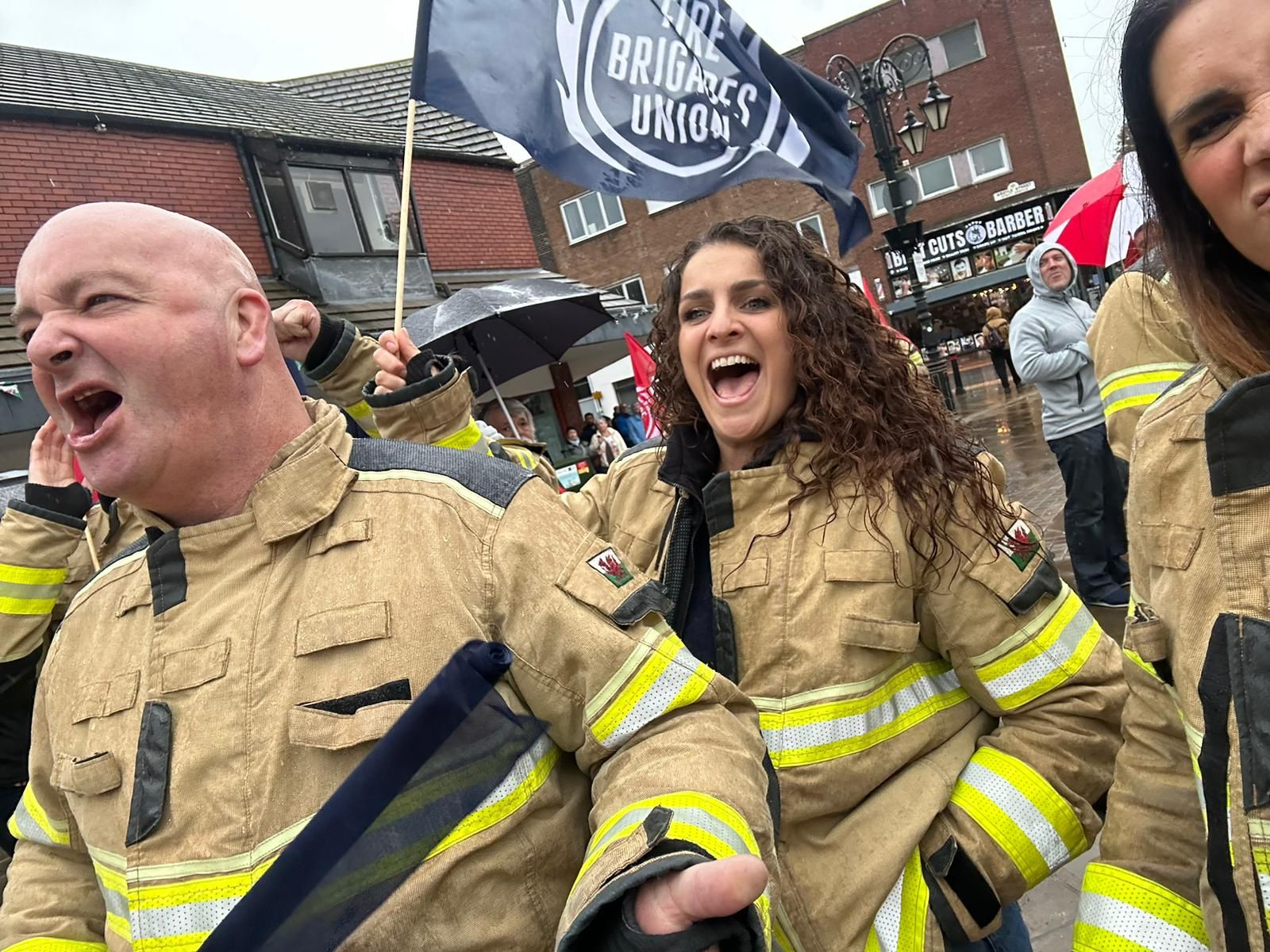 Firefighters chanting at a rally 