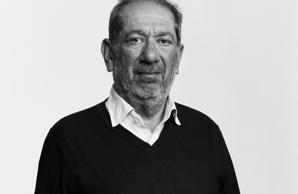 Elkan Abrahamson looking at camera in black and white