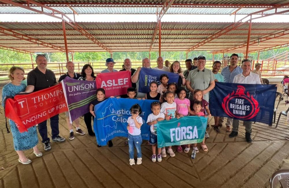 Delegations holding trade union banners in Columbia