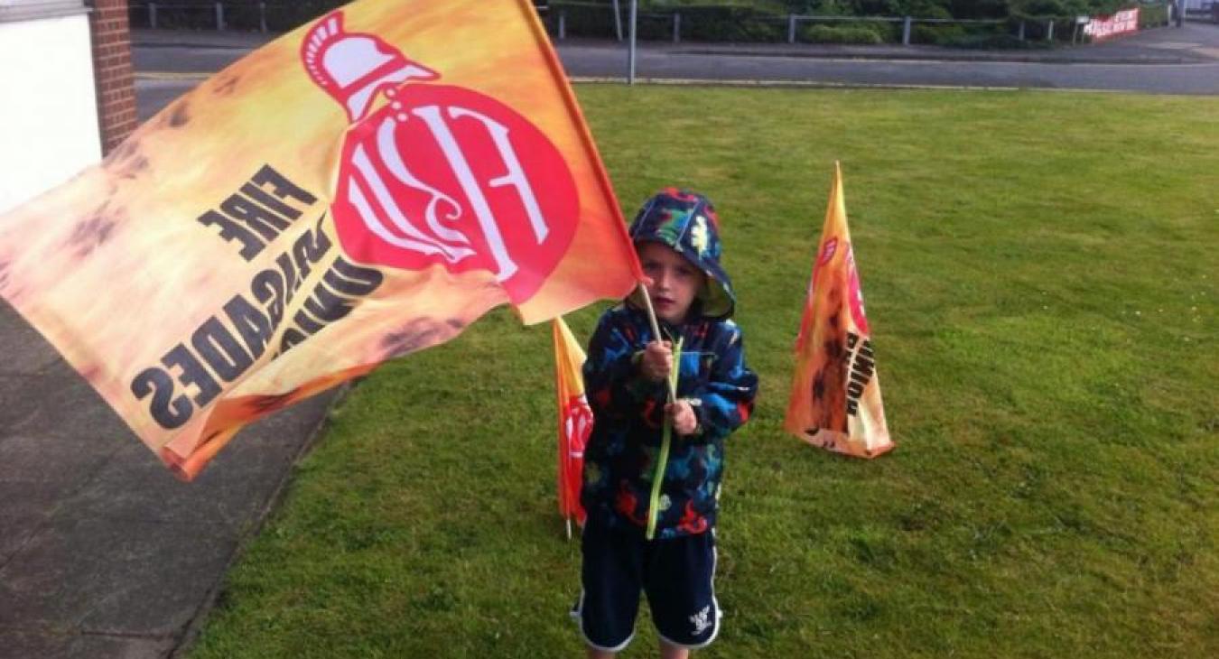 child-waving-flag