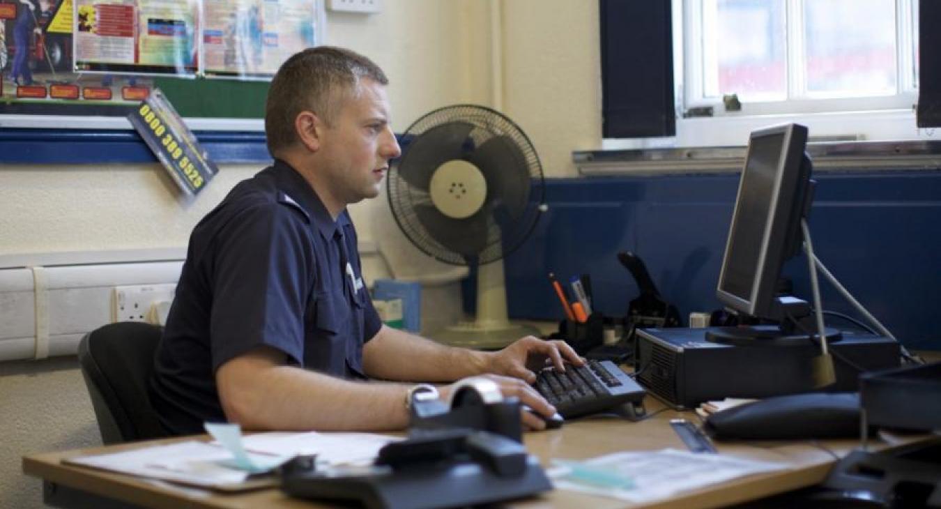 firefighter-office-sitting-computer