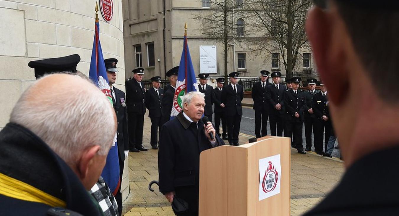 Man speaking at Leonard McCartney and Lexie Wylie Red Plaque unveiling